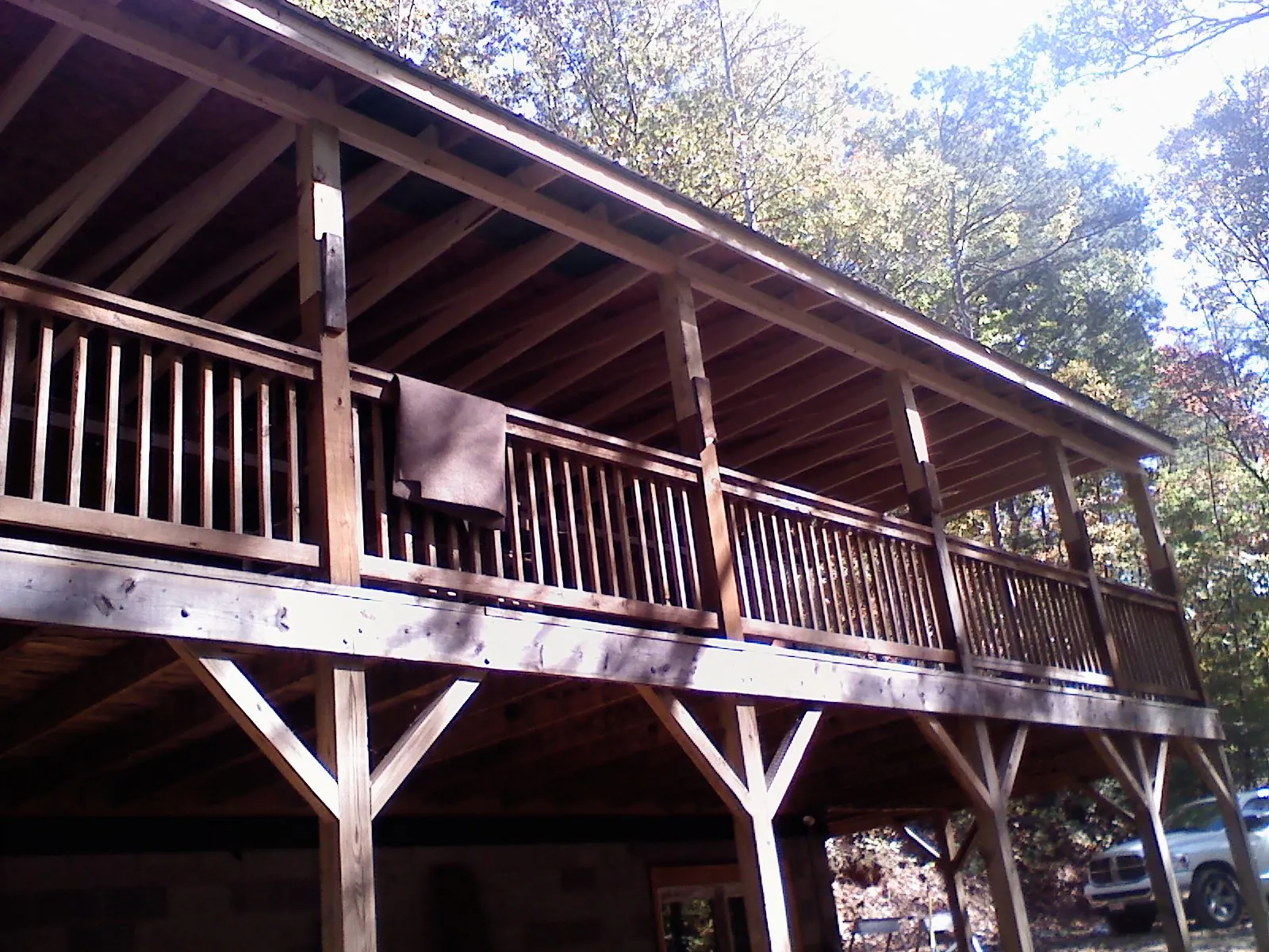Timber framing under a new elevated porch and deck — Roof Leak Repair in Plano by Roofing Brothers